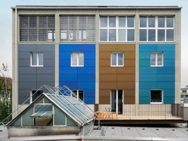 Basler Kohlesilo mit farbiger Photovoltaikanlage auf Dach und Fassade